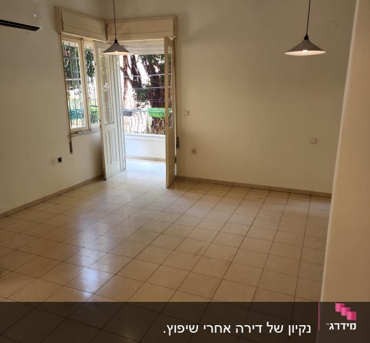 An empty room with tiled floor and open windows.